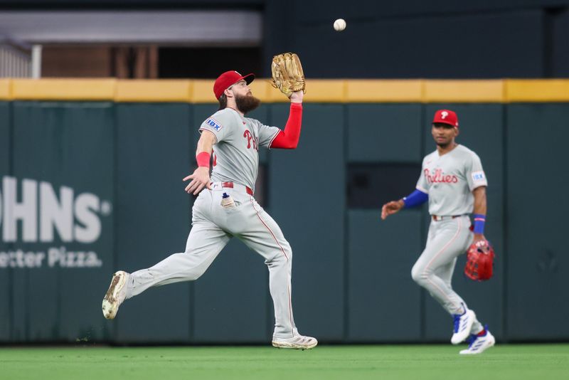 Jun 27, 2025; Atlanta, Georgia, USA; Philadelphia Phillies center fielder Brandon Marsh (16) catches a fly ball against the Atlanta Braves in the sixth inning at Truist Park. Mandatory Credit: Brett Davis-Imagn Images
