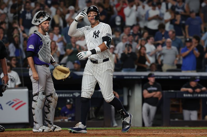 Aug 23, 2024; Bronx, New York, USA;  New York Yankees center fielder Aaron Judge (99) celebrates his solo home run during the sixth inning against the Colorado Rockies at Yankee Stadium. Mandatory Credit: Vincent Carchietta-USA TODAY Sports