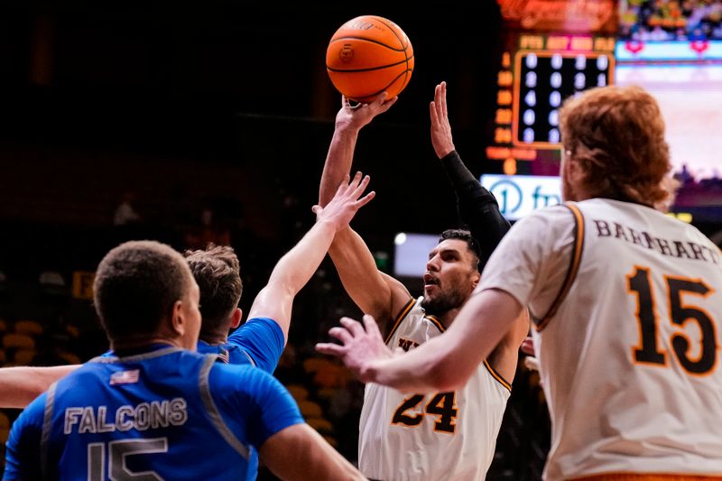 Feb 17, 2023; Laramie, Wyoming, USA; Wyoming Cowboys guard Hunter Maldonado (24) shoots against the Air Force Falcons during the first half at Arena-Auditorium. Mandatory Credit: Troy Babbitt-USA TODAY Sports