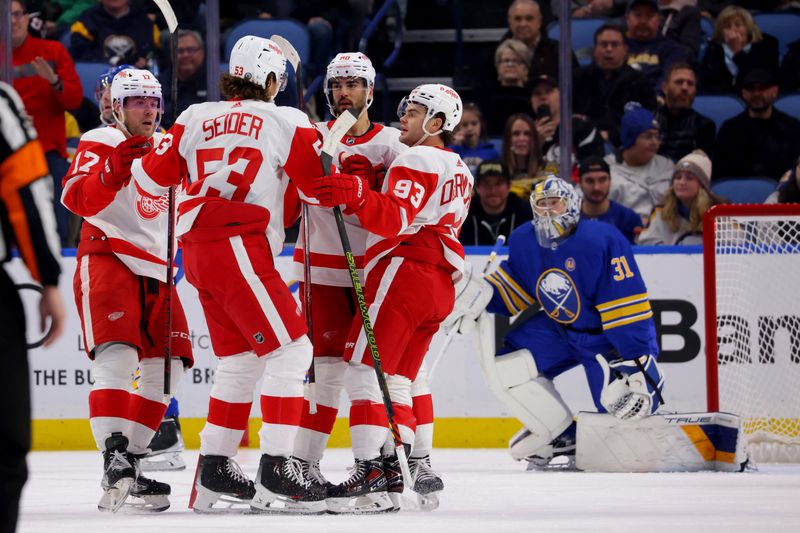 Dec 5, 2023; Buffalo, New York, USA;  Detroit Red Wings defenseman Moritz Seider (53) celebrates his goal with teammates during the second period against the Buffalo Sabres at KeyBank Center. Mandatory Credit: Timothy T. Ludwig-USA TODAY Sports