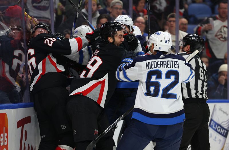 Mar 3, 2024; Buffalo, New York, USA;  Buffalo Sabres and Winnipeg Jets get into a scrum after the whistle during the first period at KeyBank Center. Mandatory Credit: Timothy T. Ludwig-USA TODAY Sports