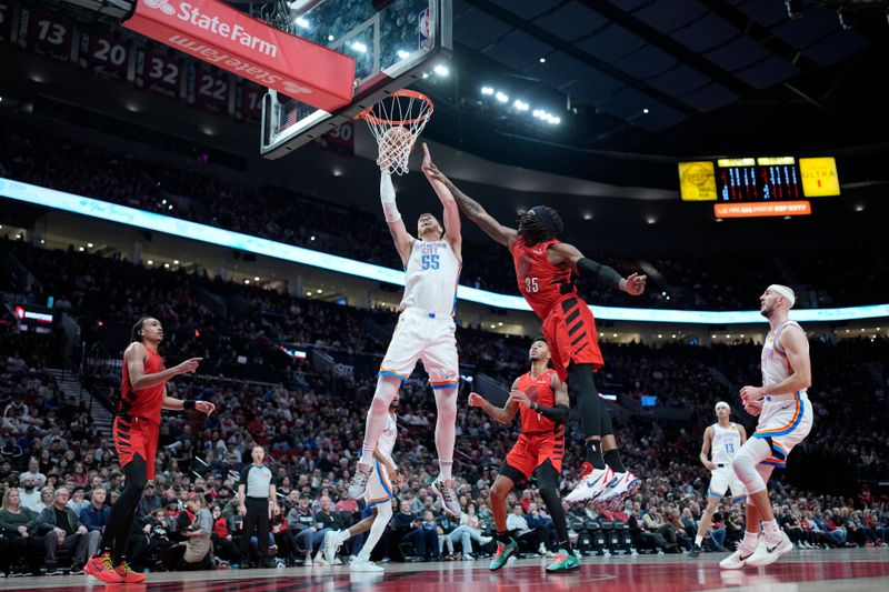 PORTLAND, OREGON - JANUARY 26: Isaiah Hartenstein #55 of the Oklahoma City Thunder is fouled while shooting by Robert Williams III #35 of the Portland Trail Blazers during the first half at Moda Center on January 26, 2025 in Portland, Oregon. NOTE TO USER: User expressly acknowledges and agrees that, by downloading and or using this photograph, User is consenting to the terms and conditions of the Getty Images License Agreement. (Photo by Soobum Im/Getty Images)