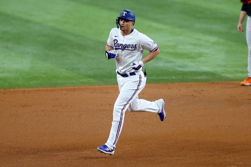 Oct 10, 2023; Arlington, Texas, USA; Texas Rangers shortstop Corey Seager (5) runs after hitting a home run against the Baltimore Orioles in the first inning during game three of the ALDS for the 2023 MLB playoffs at Globe Life Field. Mandatory Credit: Andrew Dieb-USA TODAY Sports