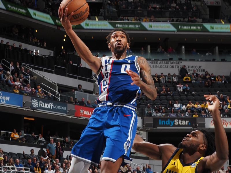 INDIANAPOLIS, IN - FEBRUARY 2: Malik Monk #0 of the Sacramento Kings drives to the basket during the game against the Indiana Pacers on February 2, 2024 at Gainbridge Fieldhouse in Indianapolis, Indiana. NOTE TO USER: User expressly acknowledges and agrees that, by downloading and or using this Photograph, user is consenting to the terms and conditions of the Getty Images License Agreement. Mandatory Copyright Notice: Copyright 2024 NBAE (Photo by Ron Hoskins/NBAE via Getty Images)