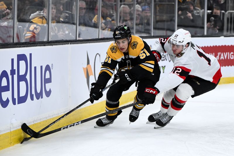 Jan 23, 2025; Boston, Massachusetts, USA; Boston Bruins center Matthew Poitras (51) skates against Ottawa Senators center Shane Pinto (12) during the third period at the TD Garden. Mandatory Credit: Brian Fluharty-Imagn Images