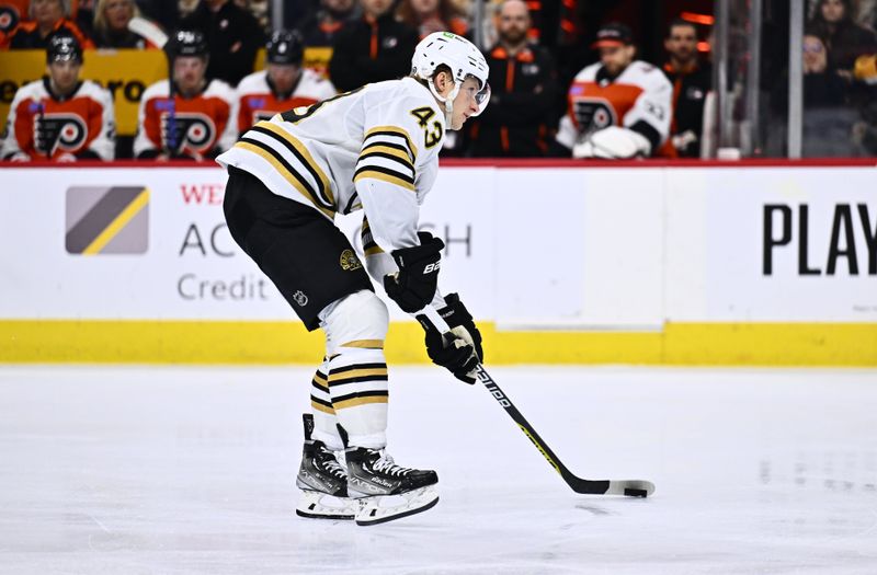 Jan 27, 2024; Philadelphia, Pennsylvania, USA; Boston Bruins center Danton Heinen (43) controls the puck against the Philadelphia Flyers in the third period at Wells Fargo Center. Mandatory Credit: Kyle Ross-USA TODAY Sports