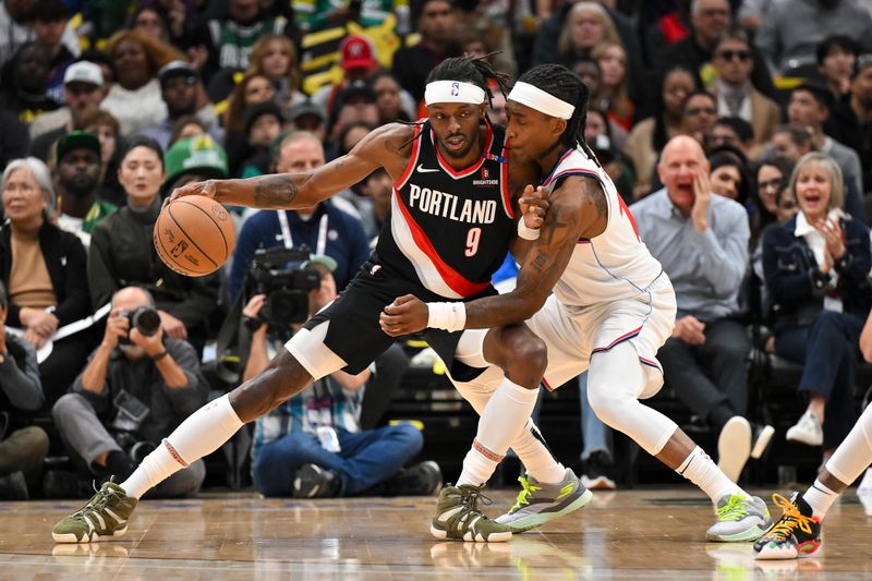 SEATTLE, WASHINGTON - OCTOBER 11: Jerami Grant #9 of the Portland Trail Blazers dribbles against Terance Mann #14 of the LA Clippers during the first quarter of the Rain City Showcase game at Climate Pledge Arena on October 11, 2024 in Seattle, Washington. The LA Clippers won 101-99. NOTE TO USER: User expressly acknowledges and agrees that, by downloading and or using this photograph, User is consenting to the terms and conditions of the Getty Images License Agreement. (Photo by Alika Jenner/Getty Images)