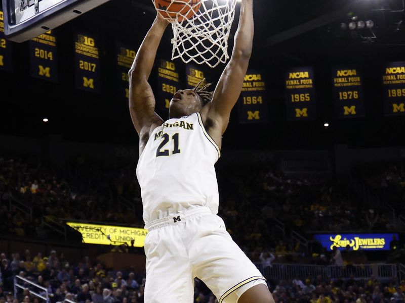 Jan 2, 2026; Ann Arbor, Michigan, USA;  Michigan Wolverines forward Morez Johnson Jr. (21) dunks in the first half against the Southern California Trojans at Crisler Center. Mandatory Credit: Rick Osentoski-Imagn Images