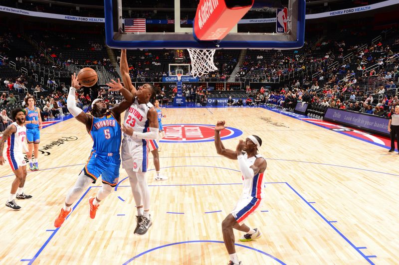 DETROIT, MI - OCTOBER 11: Luguentz Dort #5 of the Oklahoma City Thunder drives to the basket during the game against the Detroit Pistons on October 11, 2022 at Little Caesars Arena in Detroit, Michigan. NOTE TO USER: User expressly acknowledges and agrees that, by downloading and/or using this photograph, User is consenting to the terms and conditions of the Getty Images License Agreement. Mandatory Copyright Notice: Copyright 2022 NBAE (Photo by Chris Schwegler/NBAE via Getty Images)