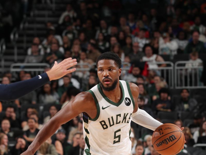 MILWAUKEE, WI - OCTOBER 20: Malik Beasley #5 of the Milwaukee Bucks handles the ball during the preseason game on October 20, 2023 at the Fiserv Forum Center in Milwaukee, Wisconsin. NOTE TO USER: User expressly acknowledges and agrees that, by downloading and or using this Photograph, user is consenting to the terms and conditions of the Getty Images License Agreement. Mandatory Copyright Notice: Copyright 2023 NBAE (Photo by Gary Dineen/NBAE via Getty Images).