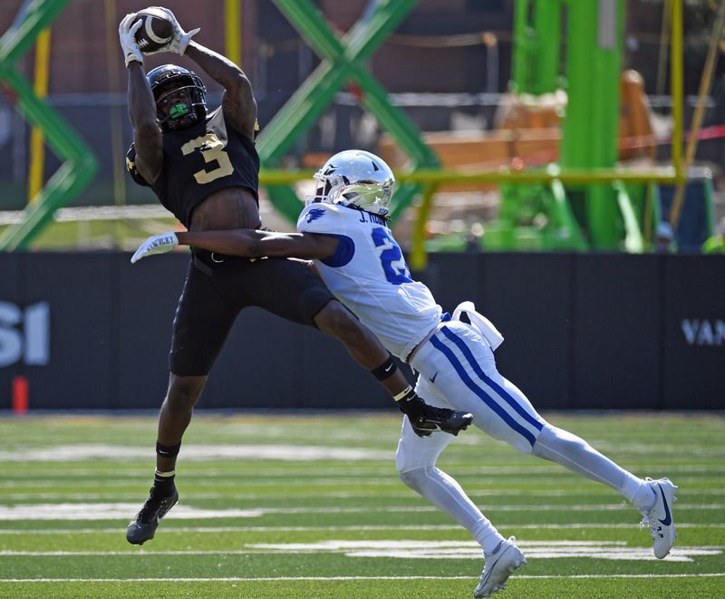 Sep 23, 2023; Nashville, Tennessee, USA; Vanderbilt Commodores wide receiver Quincy Skinner Jr. (3) catches a pass against Kentucky Wildcats defensive back Jordan Robinson (28) during the second half at FirstBank Stadium. Mandatory Credit: Christopher Hanewinckel-USA TODAY Sports