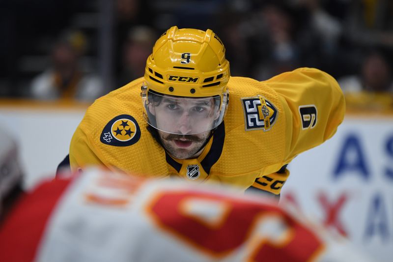 Jan 4, 2024; Nashville, Tennessee, USA; Nashville Predators left wing Filip Forsberg (9) waits for a face off during the third period against the Calgary Flames at Bridgestone Arena. Mandatory Credit: Christopher Hanewinckel-USA TODAY Sports