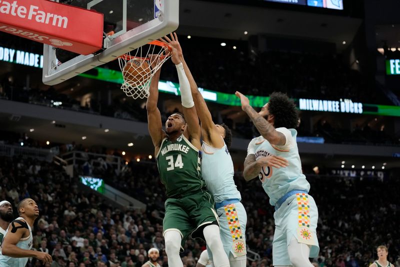 MILWAUKEE, WISCONSIN - JANUARY 08: Giannis Antetokounmpo #34 of the Milwaukee Bucks dunks the ball against Victor Wembanyama #1 of the San Antonio Spurs during the first quarter at Fiserv Forum on January 08, 2025 in Milwaukee, Wisconsin. NOTE TO USER: User expressly acknowledges and agrees that, by downloading and or using this photograph, User is consenting to the terms and conditions of the Getty Images License Agreement. (Photo by Patrick McDermott/Getty Images)