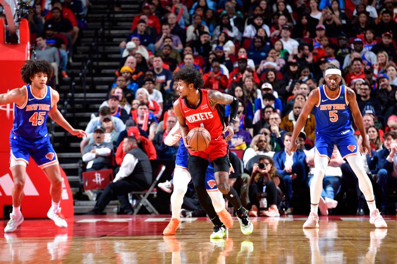 HOUSTON, TX - FEBRUARY 12: Jalen Green #4 of the Houston Rockets looks to pass the ball during the game against the New York Knicks on February 12, 2024 at the Toyota Center in Houston, Texas. NOTE TO USER: User expressly acknowledges and agrees that, by downloading and or using this photograph, User is consenting to the terms and conditions of the Getty Images License Agreement. Mandatory Copyright Notice: Copyright 2024 NBAE (Photo by Logan Riely/NBAE via Getty Images)