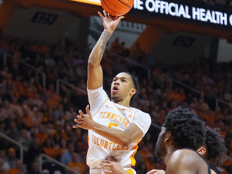 Feb 25, 2023; Knoxville, Tennessee, USA; Tennessee Volunteers guard Zakai Zeigler (5) shoots against the South Carolina Gamecocks during the first half at Thompson-Boling Arena. Mandatory Credit: Randy Sartin-USA TODAY Sports