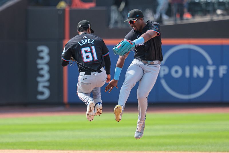 Aug 18, 2024; New York City, New York, USA; Miami Marlins second baseman Otto Lopez (61) celebrates with right fielder Jesus Sanchez (12) after defeating the New York Mets at Citi Field. Mandatory Credit: Vincent Carchietta-USA TODAY Sports