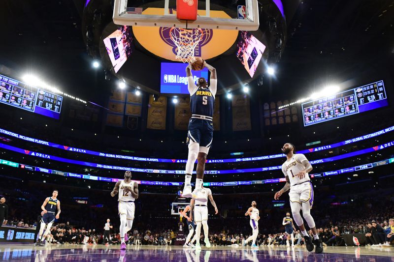 LOS ANGELES, CA - APRIL 27: Kentavious Caldwell-Pope #5 of the Denver Nuggets drives to the basket during the games against the Los Angeles Lakers during Round 1 Game 4 of the 2024 NBA Playoffs on April 27, 2024 at Crypto.Com Arena in Los Angeles, California. NOTE TO USER: User expressly acknowledges and agrees that, by downloading and/or using this Photograph, user is consenting to the terms and conditions of the Getty Images License Agreement. Mandatory Copyright Notice: Copyright 2024 NBAE (Photo by Adam Pantozzi/NBAE via Getty Images)