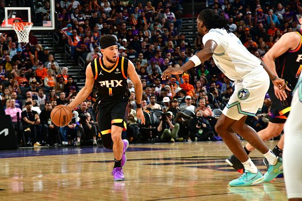 PHOENIX, AZ - NOVEMBER 15: Devin Booker #1 of the Phoenix Suns dribbles the ball during the game against the Minnesota Timberwolves on November 15, 2023 at Footprint Center in Phoenix, Arizona. NOTE TO USER: User expressly acknowledges and agrees that, by downloading and or using this photograph, user is consenting to the terms and conditions of the Getty Images License Agreement. Mandatory Copyright Notice: Copyright 2023 NBAE (Photo by Kate Frese/NBAE via Getty Images)