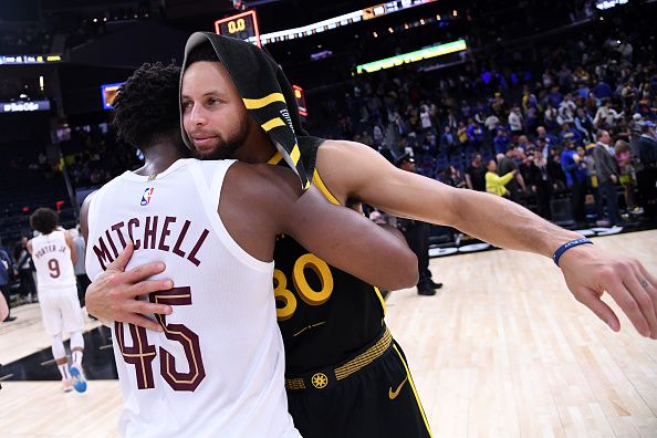 SAN FRANCISCO, CA - NOVEMBER 11: Donovan Mitchell #45 of the Cleveland Cavaliers embraces Stephen Curry #30 of the Golden State Warriors after the game on November 11, 2023 at Chase Center in San Francisco, California. NOTE TO USER: User expressly acknowledges and agrees that, by downloading and or using this photograph, user is consenting to the terms and conditions of Getty Images License Agreement. Mandatory Copyright Notice: Copyright 2023 NBAE (Photo by Noah Graham/NBAE via Getty Images)