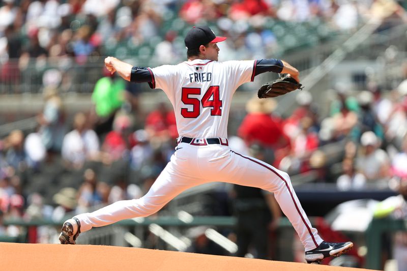 Aug 4, 2024; Cumberland, Georgia, USA; Atlanta Braves starting pitcher Max Fried (54) pitches against the Miami Marlins in the first inning at Truist Park. Mandatory Credit: Mady Mertens-USA TODAY Sports