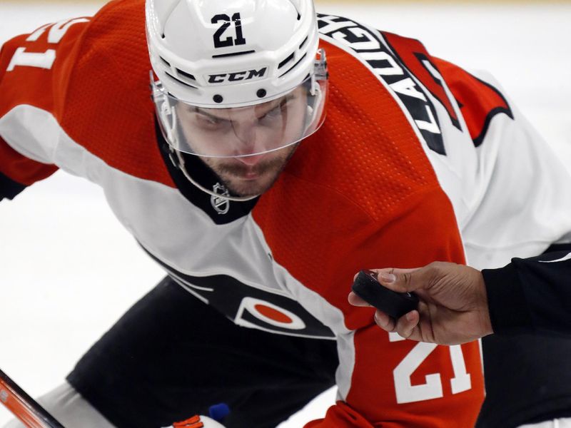 Feb 25, 2024; Pittsburgh, Pennsylvania, USA;  Philadelphia Flyers right wing Travis Konecny (11) waits for the puck drop on a face-off against the Pittsburgh Penguins during the first period at PPG Paints Arena. Mandatory Credit: Charles LeClaire-USA TODAY Sports