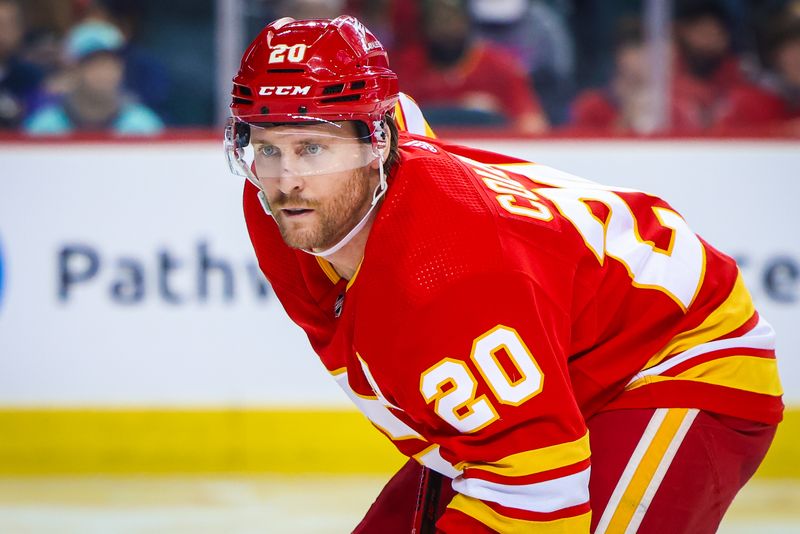 Mar 4, 2024; Calgary, Alberta, CAN; Calgary Flames center Blake Coleman (20) during the face off against the Seattle Kraken during the second period at Scotiabank Saddledome. Mandatory Credit: Sergei Belski-USA TODAY Sports