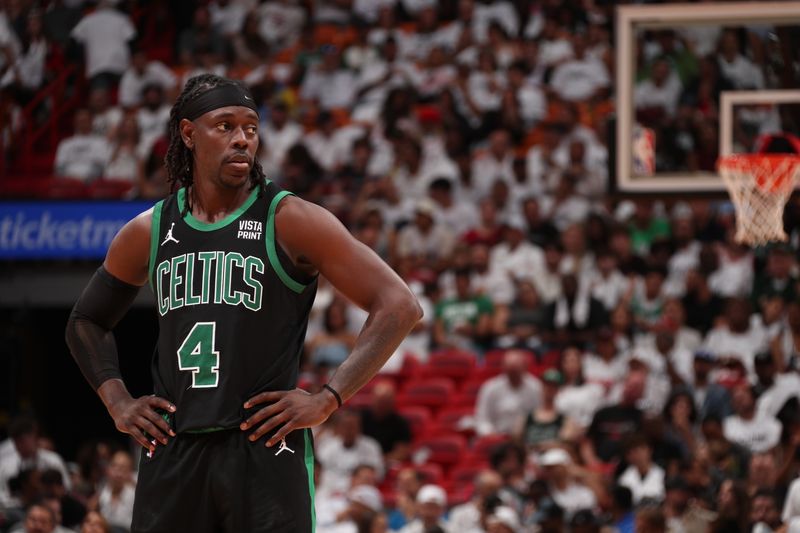 MIAMI, FL - APRIL 27: Jrue Holiday #4 of the Boston Celtics looks on during the game against the Miami Heat during Round 1 Game 3 of the 2024 NBA Playoffs on April 27, 2024 at Kaseya Center in Miami, Florida. NOTE TO USER: User expressly acknowledges and agrees that, by downloading and or using this Photograph, user is consenting to the terms and conditions of the Getty Images License Agreement. Mandatory Copyright Notice: Copyright 2024 NBAE (Photo by Issac Baldizon/NBAE via Getty Images)