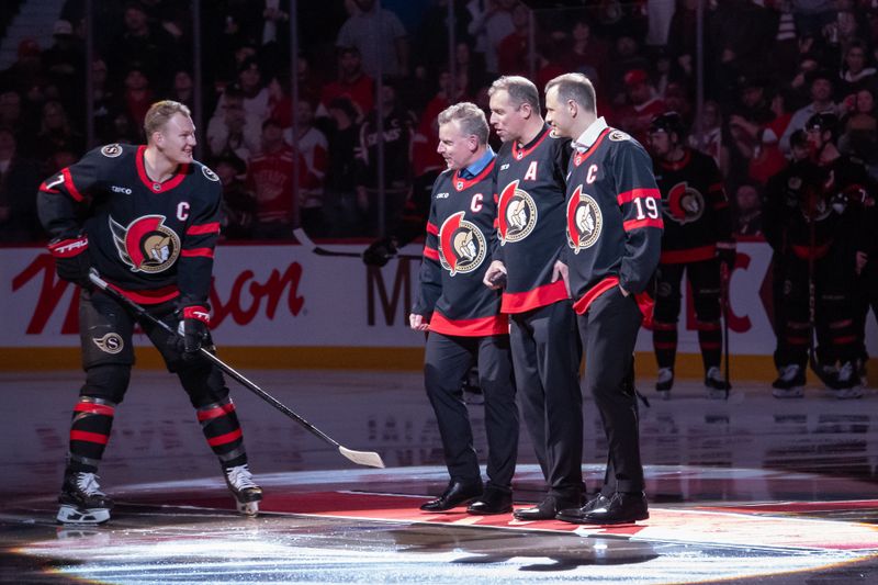 Dec 5, 2024; Ottawa, Ontario, CAN;  Ottawa Senators center Brady Tkachuk (7) skates up to center ice for a ceremonial faceoff with former Senators Daniel Alfredsson, Dany Heatley, and Jason Spezza prior to the game against the Detroit Red Wings at the Canadian Tire Centre. Mandatory Credit: Marc DesRosiers-Imagn Images