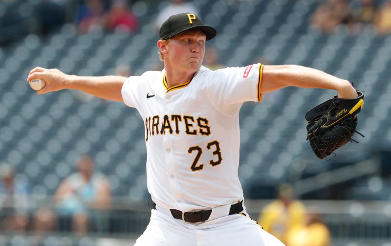 Jul 8, 2024; Pittsburgh, Pennsylvania, USA;  Pittsburgh Pirates starting pitcher Mitch Keller (23) delivers a pitch against the New York Mets during the first inning at PNC Park. Mandatory Credit: Charles LeClaire-USA TODAY Sports