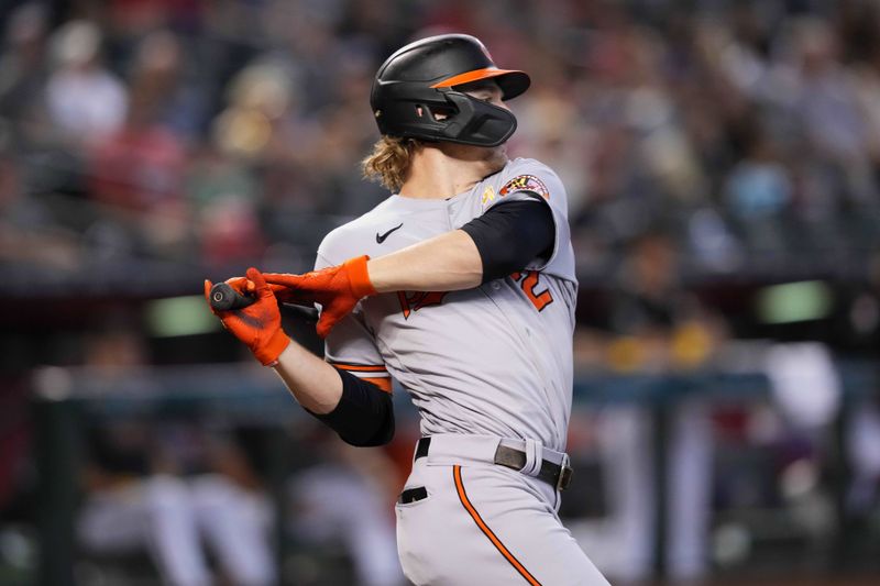 Sep 3, 2023; Phoenix, Arizona, USA; Baltimore Orioles shortstop Gunnar Henderson (2) hits an RBI single against the Arizona Diamondbacks during the first inning at Chase Field. Mandatory Credit: Joe Camporeale-USA TODAY Sports