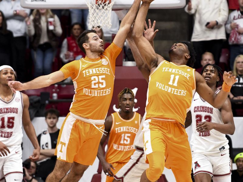 Mar 2, 2024; Tuscaloosa, Alabama, USA;  Tennessee guard Santiago Vescovi (25) and Tennessee forward Tobe Awaka (11) grab an offensive rebound at Coleman Coliseum. Tennessee defeated Alabama 81-74. Mandatory Credit: Gary Cosby Jr.-USA TODAY Sports