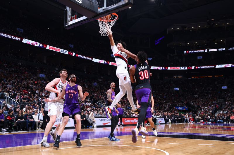 TORONTO, CANADA - APRIL 3:    Shaedon Sharpe #17 of the Portland Trail Blazers drives to the basket during the game against the Toronto Raptors  on April 3, 2025 at the Scotiabank Arena in Toronto, Ontario, Canada.  NOTE TO USER: User expressly acknowledges and agrees that, by downloading and or using this Photograph, user is consenting to the terms and conditions of the Getty Images License Agreement.  Mandatory Copyright Notice: Copyright 2025 NBAE (Photo by Vaughn Ridley/NBAE via Getty Images)