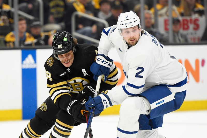 Apr 20, 2024; Boston, Massachusetts, USA; Boston Bruins right wing David Pastrnak (88) and Toronto Maple Leafs defenseman Simon Benoit (2) battle during the third period in game one of the first round of the 2024 Stanley Cup Playoffs at TD Garden. Mandatory Credit: Bob DeChiara-USA TODAY Sports