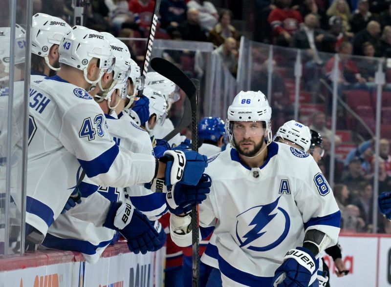 Nov 7, 2023; Montreal, Quebec, CAN; Tampa Bay Lightning forward Nikita Kucherov (86) celebrates with teammates after scoring a goal against the Montreal Canadiens during the first period at the Bell Centre. Mandatory Credit: Eric Bolte-USA TODAY Sports