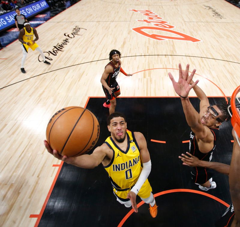 DETROIT, MI - MARCH 20: Tyrese Haliburton #0 of the Indiana Pacers drives to the basket during the game against the Detroit Pistons on March 20, 2024 at Little Caesars Arena in Detroit, Michigan. NOTE TO USER: User expressly acknowledges and agrees that, by downloading and/or using this photograph, User is consenting to the terms and conditions of the Getty Images License Agreement. Mandatory Copyright Notice: Copyright 2024 NBAE (Photo by Brian Sevald/NBAE via Getty Images)