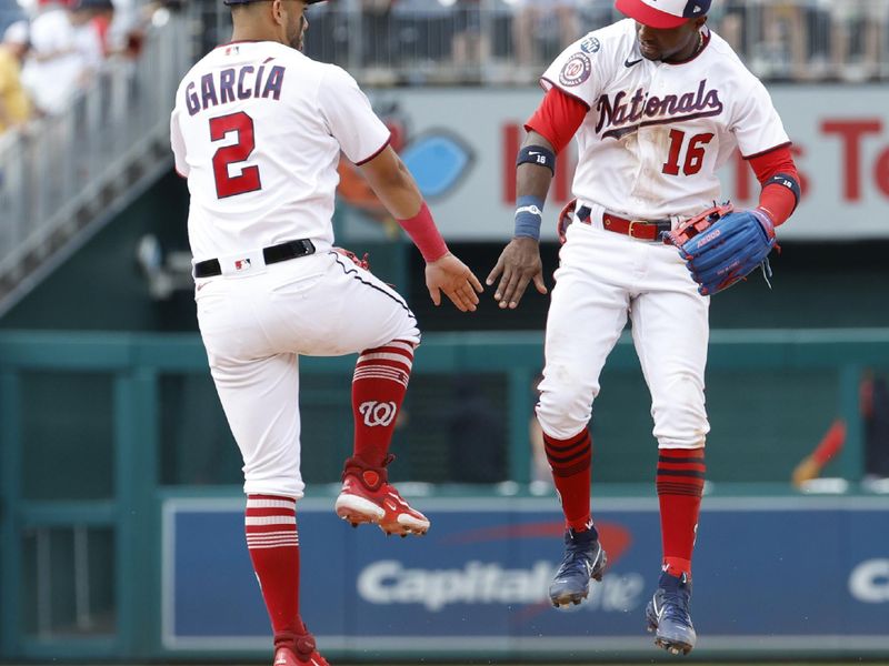 Apr 16, 2023; Washington, District of Columbia, USA; Washington Nationals second baseman Luis Garcia (2) celebrates with Nationals center fielder Victor Robles (16) after their game against the Cleveland Guardians at Nationals Park. Mandatory Credit: Geoff Burke-USA TODAY Sports