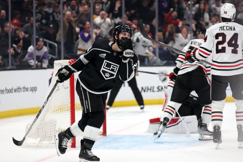 Mar 19, 2024; Los Angeles, California, USA;  Los Angeles Kings center Phillip Danault (24) reacts after scoring a goal during the third period against the Chicago Blackhawks at Crypto.com Arena. Mandatory Credit: Kiyoshi Mio-USA TODAY Sports