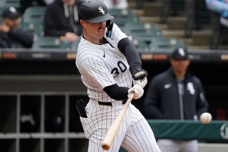 May 21, 2025; Chicago, Illinois, USA; Chicago White Sox first base Tim Elko (30) hits a home run against the Seattle Mariners during the third inning at Rate Field. Mandatory Credit: David Banks-Imagn Images