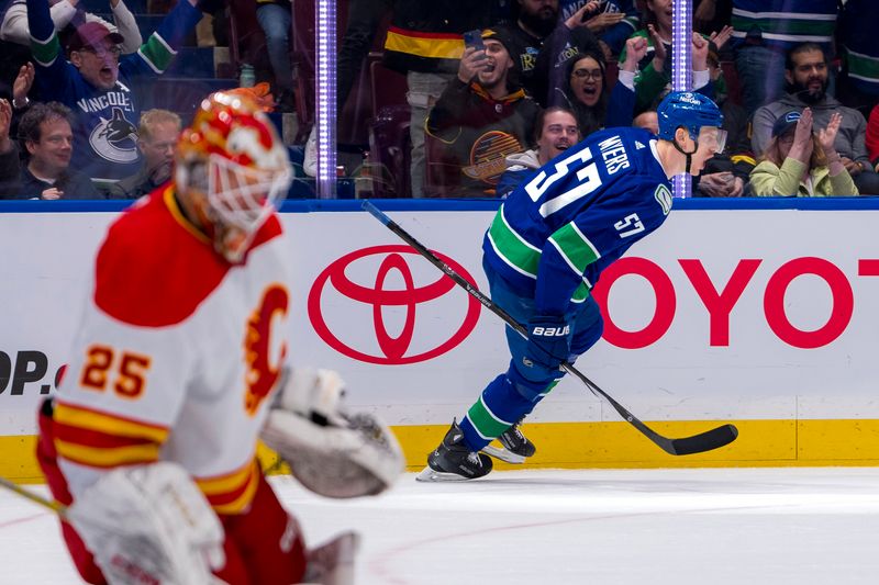 Apr 16, 2024; Vancouver, British Columbia, CAN; Vancouver Canucks defenseman Tyler Myers (57) celebrates his shorthanded goal scored on Calgary Flames goalie Jacob Markstrom (25) in the first period at Rogers Arena. Mandatory Credit: Bob Frid-USA TODAY Sports