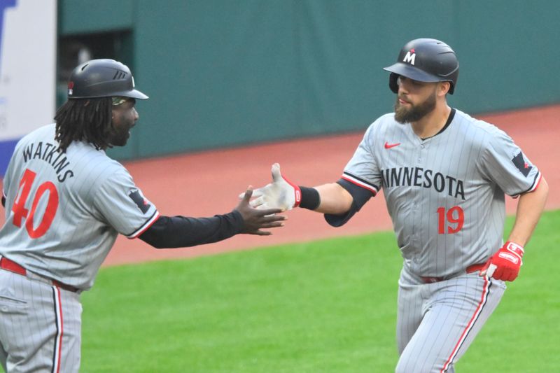 May 17, 2024; Cleveland, Ohio, USA; Minnesota Twins left fielder Alex Kirilloff (19) celebrates his solo home run with third base coach/outfield coach Tommy Watkins (40) in the third inning against the Cleveland Guardians at Progressive Field. Mandatory Credit: David Richard-USA TODAY Sports