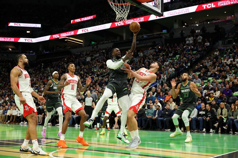 MINNEAPOLIS, MINNESOTA - NOVEMBER 26: Julius Randle #30 of the Minnesota Timberwolves goes up for a shot against Alperen Sengun #28 of the Houston Rockets in the first quarter during the Emirates NBA Cup at Target Center on November 26, 2024 in Minneapolis, Minnesota. NOTE TO USER: User expressly acknowledges and agrees that, by downloading and or using this photograph, User is consenting to the terms and conditions of the Getty Images License Agreement. (Photo by David Berding/Getty Images)