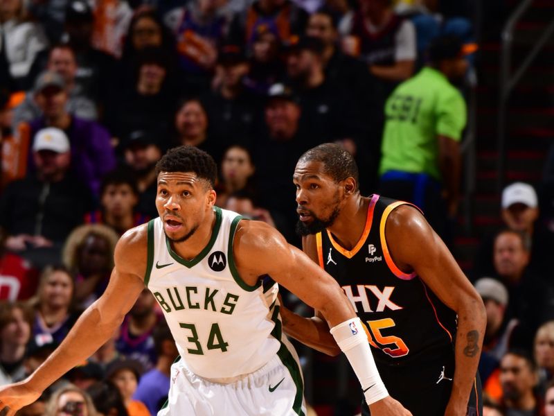 PHOENIX, AZ - FEBRUARY 6:  Giannis Antetokounmpo #34 of the Milwaukee Bucks Kevin Durant #35 of the Phoenix Suns looks on during the game on February 6, 2024 at Footprint Center in Phoenix, Arizona. NOTE TO USER: User expressly acknowledges and agrees that, by downloading and or using this photograph, user is consenting to the terms and conditions of the Getty Images License Agreement. Mandatory Copyright Notice: Copyright 2024 NBAE (Photo by Barry Gossage/NBAE via Getty Images)