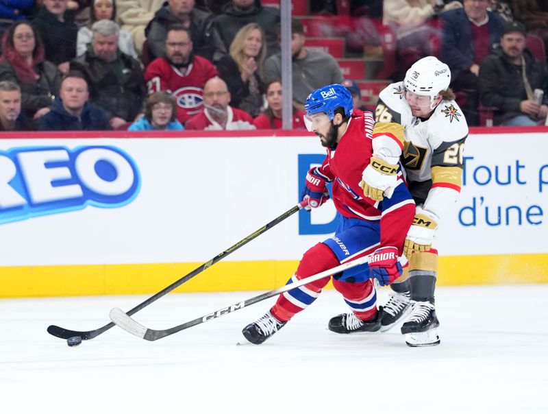 Jan 27, 2026; Montreal, Quebec, CAN; Vegas Golden Knights forward Alexander Holtz (26) grabs Montreal Canadiens forward Philip Danault (24) during the second period at the Bell Centre. Holtz (26) got a minor penalty on the play. Mandatory Credit: Eric Bolte-Imagn Images