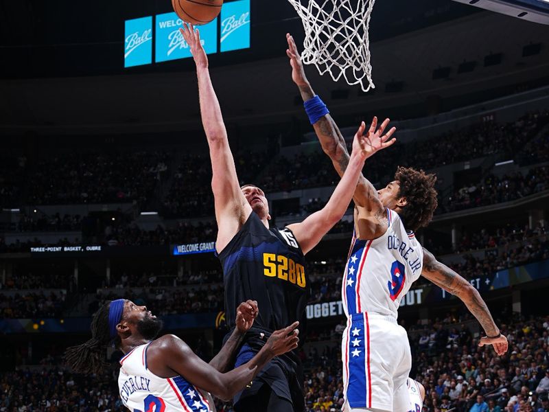 DENVER, CO - JANUARY 27: Nikola Jokic #15 of the Denver Nuggets drives to the basket during the game against the Philadelphia 76ers on January 27, 2024 at the Ball Arena in Denver, Colorado. NOTE TO USER: User expressly acknowledges and agrees that, by downloading and/or using this Photograph, user is consenting to the terms and conditions of the Getty Images License Agreement. Mandatory Copyright Notice: Copyright 2024 NBAE (Photo by Garrett Ellwood/NBAE via Getty Images)