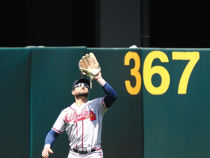 May 31, 2023; Oakland, California, USA; Atlanta Braves  left fielder Kevin Pillar (17) catches the ball against the Oakland Athletics during the ninth inning at Oakland-Alameda County Coliseum. Mandatory Credit: Kelley L Cox-USA TODAY Sports