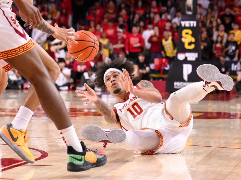 Dec 10, 2023; Los Angeles, California, USA; USC Trojans forward DJ Rodman (10) goes to the floor for a loose ball during the first half against the Long Beach State 49ers at Galen Center. Mandatory Credit: Robert Hanashiro-USA TODAY Sports