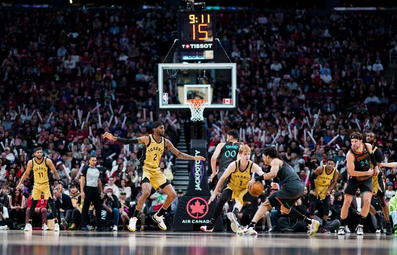 TORONTO, ON - APRIL 7: Jordan Poole #13 of the Washington Wizards dribbles against Gradey Dick #1 of the Toronto Raptors during the first half of their basketball game at the Scotiabank Arena on April 7, 2024 in Toronto, Ontario, Canada. NOTE TO USER: User expressly acknowledges and agrees that, by downloading and/or using this Photograph, user is consenting to the terms and conditions of the Getty Images License Agreement. (Photo by Mark Blinch/Getty Images)