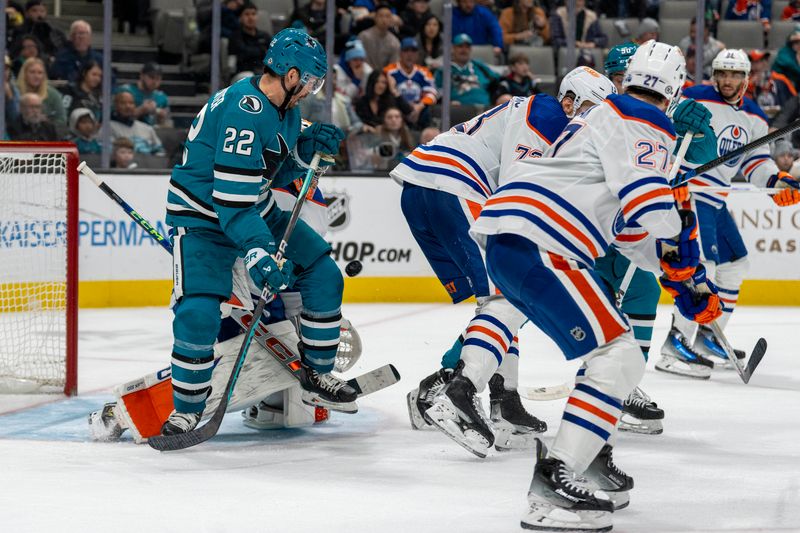 Dec 28, 2023; San Jose, California, USA; San Jose Sharks center Ryan Carpenter (22) tries to deflect the puck Edmonton Oilers goaltender Stuart Skinner (74) makes the save during the second period at SAP Center at San Jose. Mandatory Credit: Neville E. Guard-USA TODAY Sports