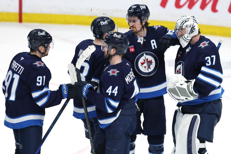 May 9, 2025; Winnipeg, Manitoba, CAN; Winnipeg Jets celebrate their victory over the Dallas Stars in game two of the second round of the 2025 Stanley Cup Playoffs at Canada Life Centre. Mandatory Credit: James Carey Lauder-Imagn Images