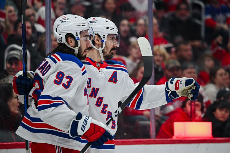 Apr 5, 2024; Detroit, Michigan, USA; New York Rangers left wing Chris Kreider (20) celebrates his goal with center Mika Zibanejad (93) during the third period against the Detroit Red Wings at Little Caesars Arena. Mandatory Credit: Tim Fuller-USA TODAY Sports